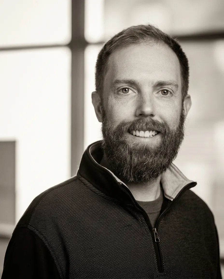 Portrait of Kevin Burgess in monochrome.